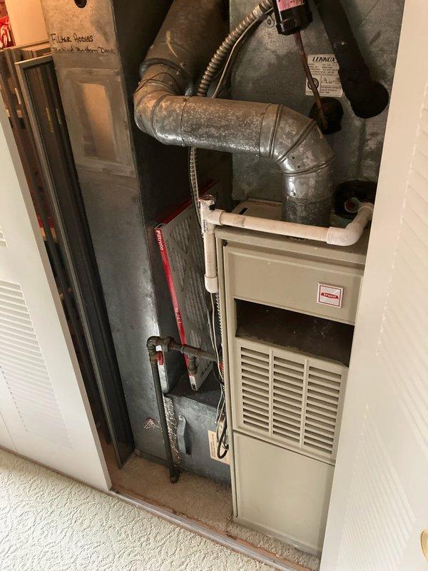 Performed comprehensive evaluation of dual-zone residential cooling system with two outdoor condensing units and corresponding indoor air handlers. The primary system, over 20 years old, and secondary system at 7 years old were both experiencing reduced cooling capacity and inadequate temperature control. Conducted thorough inspection of both indoor evaporator coil assemblies, ductwork connections, refrigerant lines, condensate drainage systems, and electrical connections. Documented existing equipment conditions including furnace integration, air handler configurations, metallic ductwork routing, and overall system layout through detailed photographic assessment. Assessed airflow patterns, component wear, and system performance limitations. Provided detailed estimate for complete HVAC system replacement including removal of aging equipment, installation of new high-efficiency units, proper refrigerant line sets, electrical upgrades, thermostat controls, and ductwork modifications as n