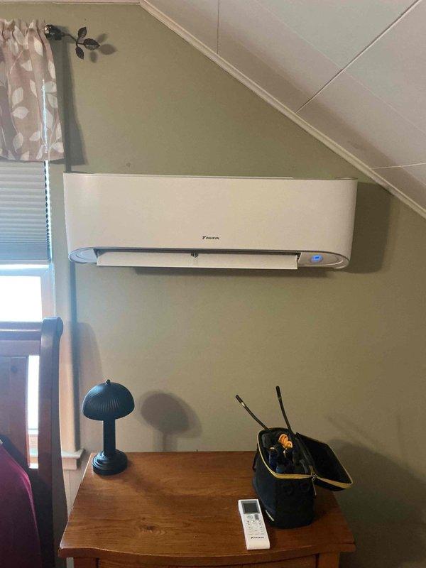 Performed routine inspection and tune-up on a 2023 Daikin ductless mini-split cooling system. Inspected indoor wall-mounted evaporator unit and outdoor condensing unit, verified proper airflow through both components, and confirmed system operational status. All components found to be functioning within normal parameters with no issues identified at time of service.