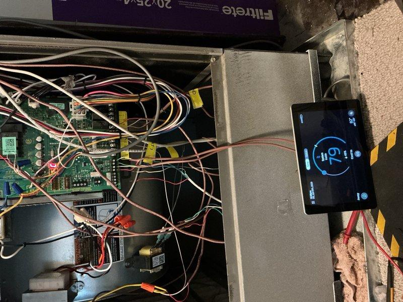 Responded to callback for rooftop Lennox unit experiencing intermittent cooling failure and blank thermostat display. Upon inspection, accessed control board and wiring compartment to diagnose electrical issues. Performed voltage testing and verified circuit board functionality using diagnostic equipment, reading 42V at test points. Identified temperature sensor/frost sensor as failed component causing system shutdown during operation. Ordered replacement temp sensor under PO 1329651-001 for installation upon arrival at shop. Documented internal wiring configuration and control board layout for follow-up repair visit.