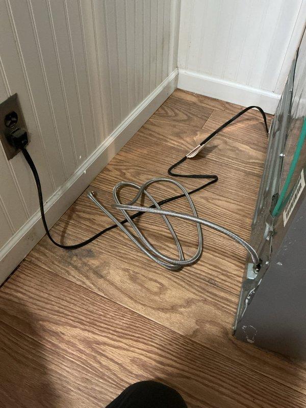 Installed new ice maker supply line from basement plumbing to refrigerator location. Routed flexible braided stainless steel water line through ceiling joists and connected to existing copper water supply system with appropriate fittings and shut-off valve for future service access.