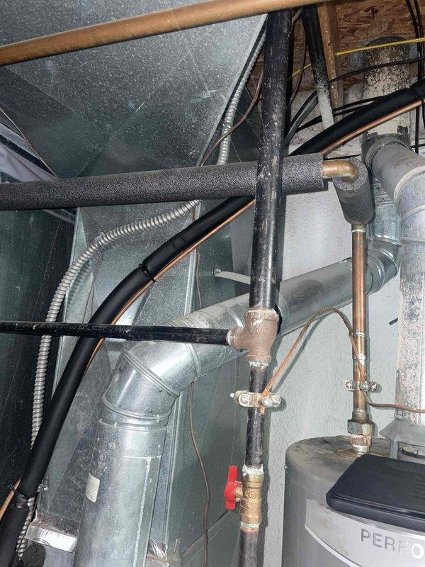 Responded to service call for air conditioning unit check-up in basement location. Upon inspection, diagnosed locked compressor on unit less than one year old. Provided detailed replacement estimate for complete AC system due to compressor failure. Documented existing HVAC installation including ductwork configuration, refrigerant lines, and mechanical connections for replacement specifications.