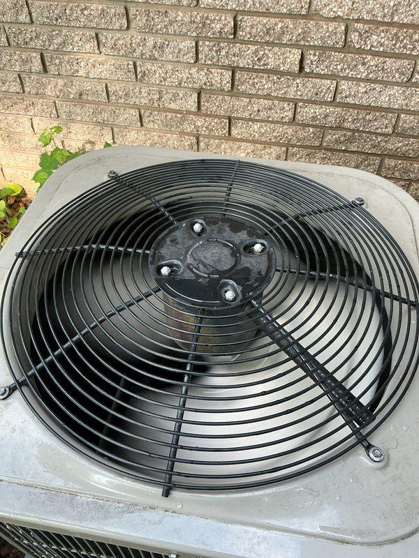 Completed comprehensive Gold AC inspection on 12-year-old residential air conditioning system with air handler located in basement. Performed full system evaluation including condenser unit examination, electrical disconnect inspection, and verified proper fan operation and component condition. Unit operating normally with all components functioning within specifications at time of inspection.