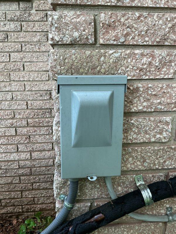 Completed comprehensive Gold AC inspection on 12-year-old residential air conditioning system with air handler located in basement. Performed full system evaluation including condenser unit examination, electrical disconnect inspection, and verified proper fan operation and component condition. Unit operating normally with all components functioning within specifications at time of inspection.