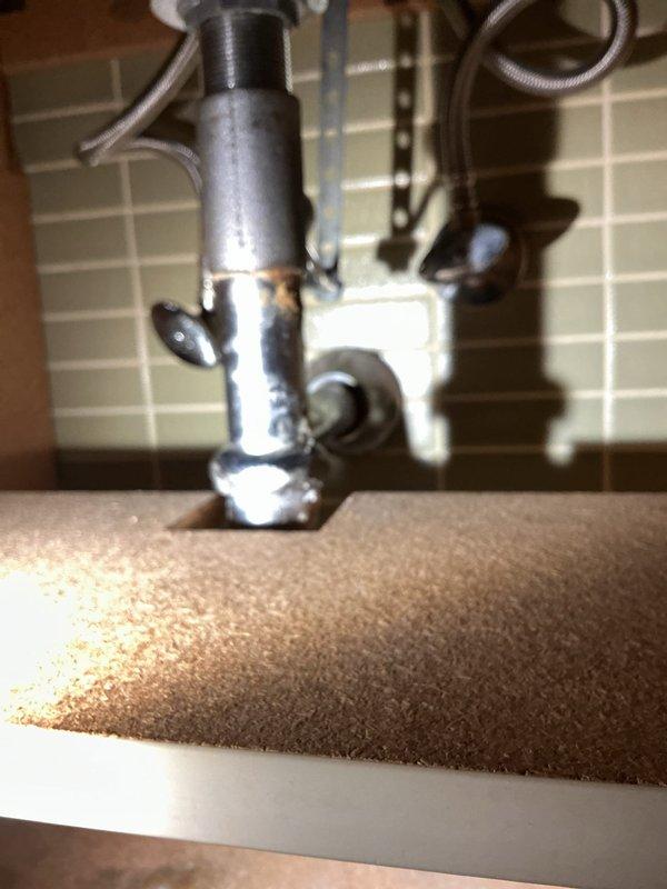 Responded to a broken bathroom faucet on the first floor of a 1968-built home. Upon inspection, found the existing chrome two-handle faucet mounted on a white speckled countertop with an olive-green basin was no longer functioning properly. Assessed the complete fixture assembly including under-sink plumbing connections and drain assembly. Provided recommendations for faucet replacement options compatible with the existing countertop configuration and advised the customer on purchasing a suitable replacement unit for future installation.