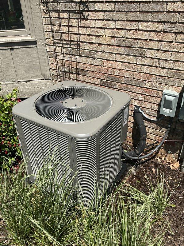 Completed comprehensive Gold AC Inspection on two residential Lennox air conditioning systems, both under 10 years of age and operating properly at time of service. Performed thorough multi-point inspection on both outdoor condenser units positioned against exterior brick wall, each mounted on concrete pads with proper clearance. Inspected electrical disconnect boxes, conduit connections, and verified secure mounting of all components. Evaluated fan operation, louver venting systems, and overall unit condition on both condensers. Confirmed air handler and coil assembly located in basement. Both systems demonstrated normal operational parameters with no deficiencies noted requiring immediate attention.