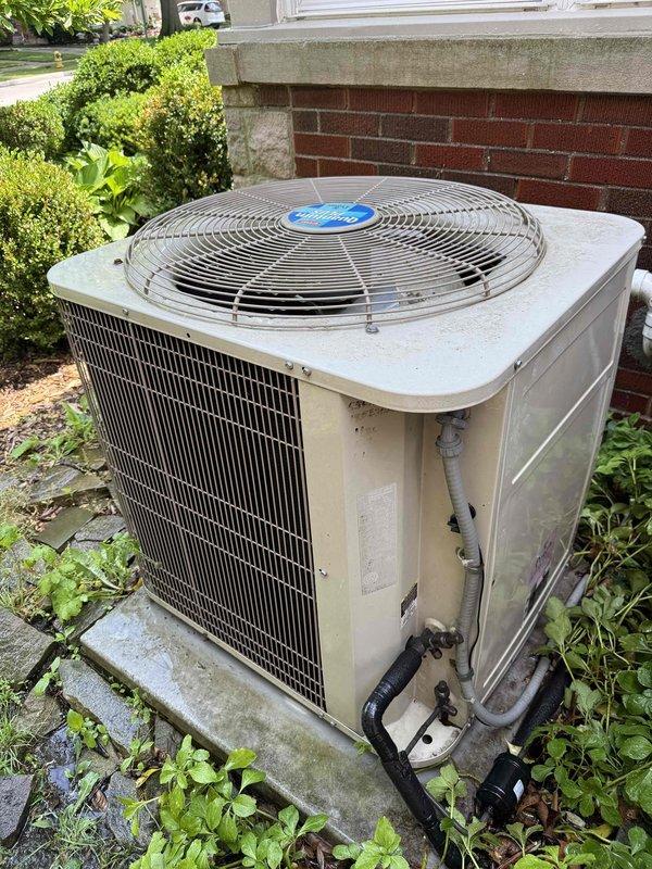 Completed comprehensive Gold AC inspection on residential split system with outdoor condenser unit and basement air handler. System is over 10 years old and operational at time of service. Performed thorough visual inspection of outdoor condenser unit, noting age-related weathering and dirt accumulation on exterior panels. Inspected refrigerant line connections, electrical conduit, and verified unit stability on concrete pad. Conducted electrical diagnostics using digital multimeter to measure voltage and amperage readings, confirming proper electrical performance within manufacturer specifications. Inspected air handler components in basement location. Provided complimentary air filter replacement as scheduled courtesy. All system components functioning properly with no immediate service needs identified. Unit continues to operate effectively despite age of equipment.