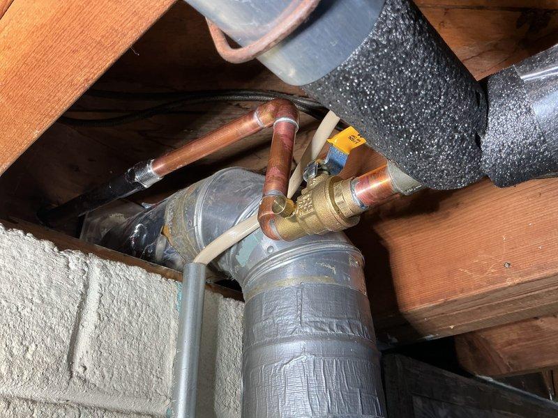 Replaced frost-free hose bib in attic crawl space, installing new copper pipe connections and brass valve assembly. Completed all soldered joints and verified proper operation of the new fixture to restore exterior water access.