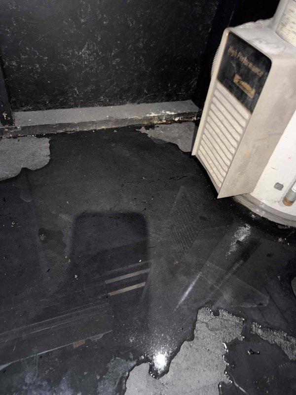 Responded to no-cool call for 10+ year old AC unit located in basement. Upon arrival, found standing water throughout basement area near furnace and hot water tank, with AC fan not operating. Inspection revealed significant water accumulation on floor creating potential electrical hazards. Documented extensive corrosion and oxidation on copper refrigerant lines, indicating long-term moisture exposure and deterioration of system components. Advised homeowner that water intrusion issue must be addressed prior to AC system evaluation and that corroded refrigerant lines will require replacement. Recommended plumbing inspection to identify source of water leak and professional water remediation services before proceeding with HVAC repairs.