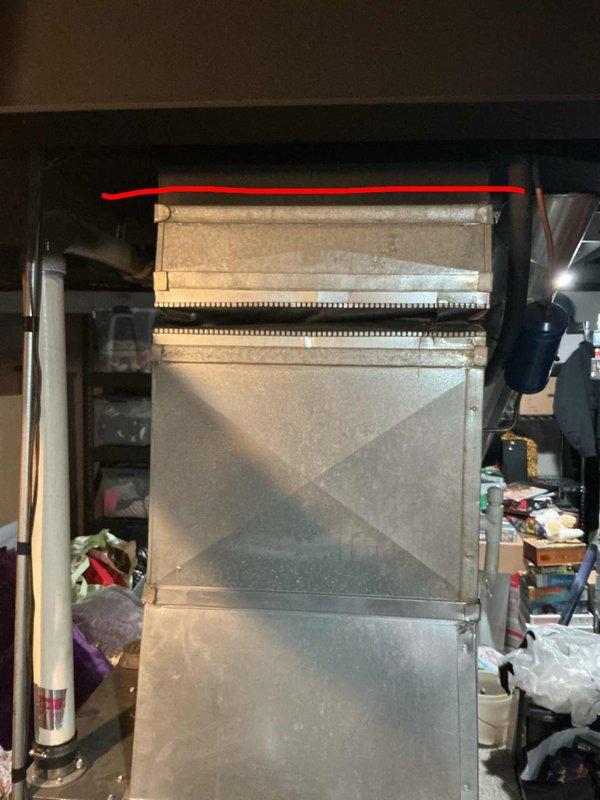 Performed comprehensive assessment of 15-year-old air conditioning system located in basement that was blowing air but not producing cold air, affecting entire home. Documented existing equipment condition through photographic evidence showing aged HVAC unit with visible wear, dust accumulation, and deteriorating components including heat exchanger with metallic fins. Provided replacement estimate for complete system due to age and failure to cool, with customer enrolling in maintenance plan for two pieces of equipment.