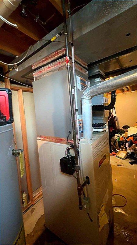 Successfully completed installation of a 3.5-ton air conditioning condenser unit and evaporator coil system in rear yard location. The outdoor condenser was positioned on a protective pad adjacent to the residence with proper refrigerant line connections, electrical conduit routing, and disconnect box mounted to exterior wall. Inside, the evaporator coil was integrated with the existing air handler unit, with all necessary ductwork connections completed. All mechanical, electrical, and air conditioning permits were secured prior to installation, and electrical work was coordinated as required for system reconnection and proper operation.