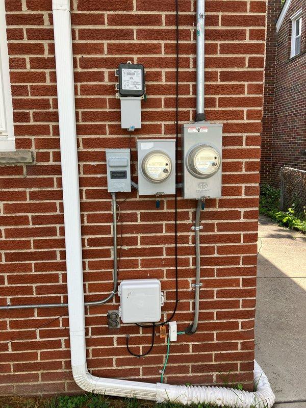 Performed comprehensive inspection and cleaning of 10+ year old cooling system located in basement. Evaluated HVAC unit condition, including ductwork connections and airflow components, and completed full system cleaning as requested. Documented exterior electrical service installation and interior equipment configuration with photographic records for reference.