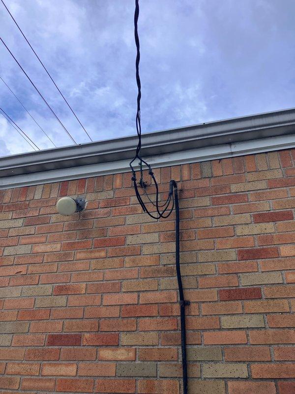 Conducted site evaluation for new central air conditioning system installation in home with no existing central air infrastructure. Assessed exterior wall conditions, electrical service accessibility, and optimal equipment placement locations. Documented brick exterior with existing electrical conduit routing, foundation ventilation points, and available mounting surfaces for condenser unit and line set installation, recommending installation approach that utilizes existing utility pathways while maintaining proper clearances from landscaping and structural elements.