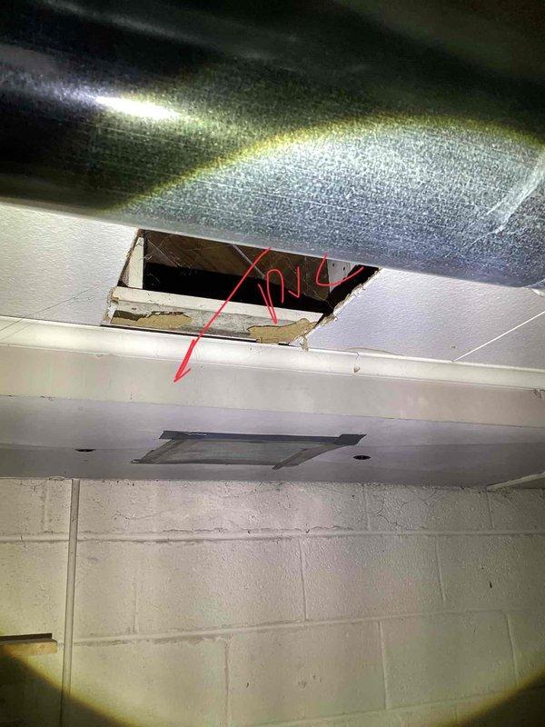 Conducted on-site evaluation for replacement of 27-year-old furnace and existing air conditioning system located in basement. Assessed current HVAC equipment configuration, including furnace cabinet, ductwork system, and condensate drainage piping. Documented existing installation measurements and specifications, noting duct sizing marked at 20" and 22" sections. Photographed equipment layout showing metal air handler unit, white furnace cabinet with ventilation slots, associated PVC condensate lines, and black refrigerant line sets. Evaluated ceiling access point and ductwork routing above suspended ceiling tiles for future installation considerations. Provided comprehensive replacement quote for new furnace and air conditioner system based on current equipment specifications and installation requirements.