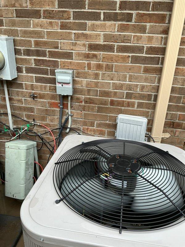 Completed comprehensive Gold AC inspection on 5-year-old residential air conditioning system with air handler located in basement. Performed multi-point inspection of outdoor condenser unit including fan motor operation, electrical connections, refrigerant lines, and cabinet condition. Verified proper operation of all system components, inspected auxiliary equipment including accumulator and electrical disconnect, and confirmed condenser area was clear of debris. System found to be operating within normal parameters with all components functioning properly.