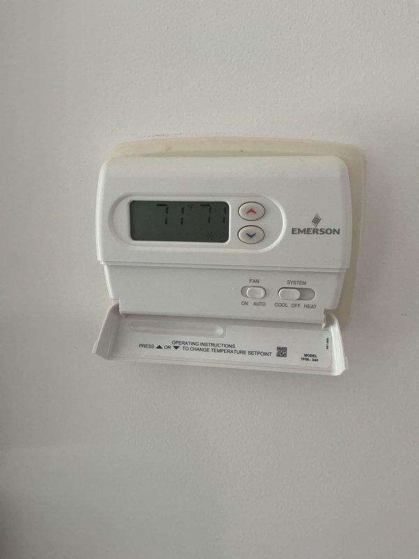 Responded to callback regarding refrigerant charge concerns from previous service visit. Customer questioned accuracy of prior technician's measurements indicating overcharge condition. Arrived during requested timeframe and performed complete system verification. Checked refrigerant pressures, superheat, and subcooling measurements at both indoor and outdoor units to confirm system charge status. Documented current thermostat settings showing 77°F display temperature and verified proper thermostat operation. Inspected refrigerant lines at air handler location, noting copper piping connections and insulation condition. Reviewed system operation and explained measurement methodology to address customer concerns regarding refrigerant charge assessment.