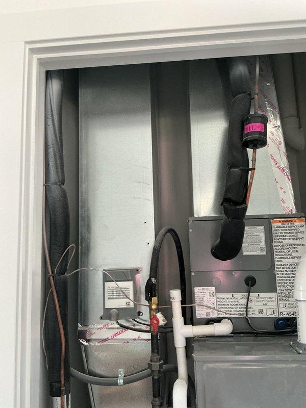Responded to service call for brand new AC unit not operating in utility room. Upon arrival, inspected air handler and associated components including condensate drainage system, refrigerant lines, and electrical connections. Verified proper installation of equipment, checked thermostat communication, and confirmed system startup and operation. Unit now functioning as designed with all safety controls operational.