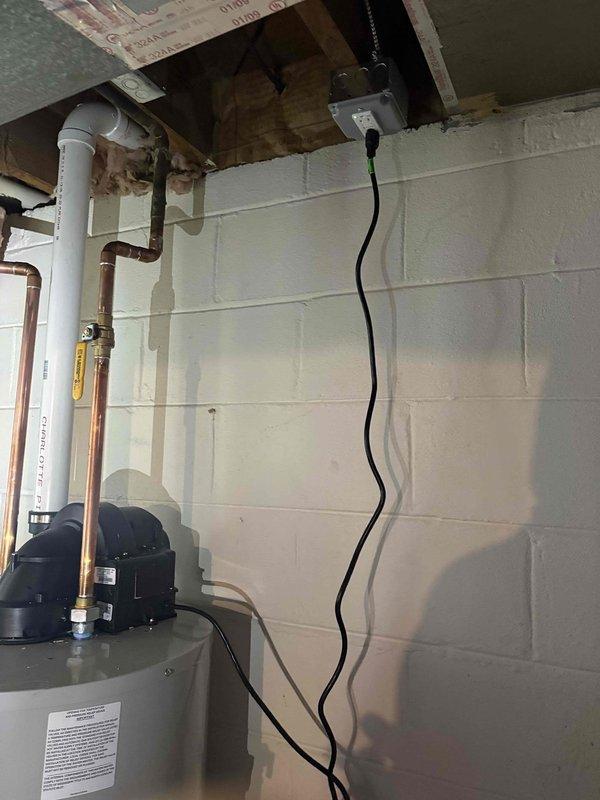 Responded to service call for newly installed photovoltaic system electrical issues causing repeated circuit tripping. Upon inspection, identified improper electrical installation in basement utility area where new PV system interconnection was affecting existing circuits. Traced electrical wiring through ceiling joists and verified proper conduit routing from basement to service panel. Corrected circuit protection issues, ensured proper grounding and bonding of electrical system, and verified all connections met NEC standards for PV installations. System tested and operational without further tripping incidents.