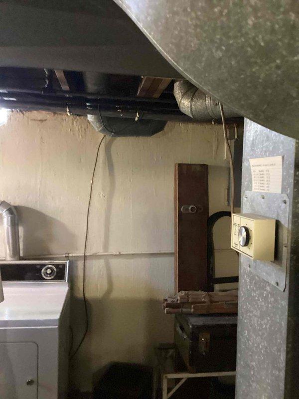 Provided comprehensive estimate for complete air conditioning system replacement for non-operational unit over 50 years old. Assessed exterior installation location and interior basement area with existing natural gas furnace to determine equipment specifications and installation requirements. Customer also inquired about wall unit service options as alternative cooling solution.