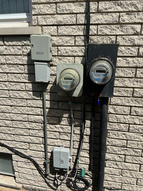 Provided comprehensive estimate for complete HVAC system replacement including air conditioning unit and natural gas furnace for 25-year-old equipment located in basement. The existing Lennox outdoor condensing unit is non-operational and requires replacement, while the furnace replacement is being quoted proactively due to age. Assessed current installation including outdoor unit positioning on concrete pad with gravel base against exterior brick wall, evaluated electrical service connections and metering configuration, and documented equipment specifications to provide accurate replacement options for both heating and cooling systems.