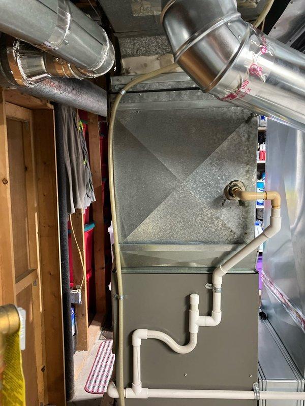 Completed full HVAC system replacement including installation of new air handler unit in basement utility area with associated ductwork connections, condensate drain lines, and refrigerant piping routed through attic space. All components properly secured, insulated, and connected per manufacturer specifications to address non-cooling issue from previously installed equipment.