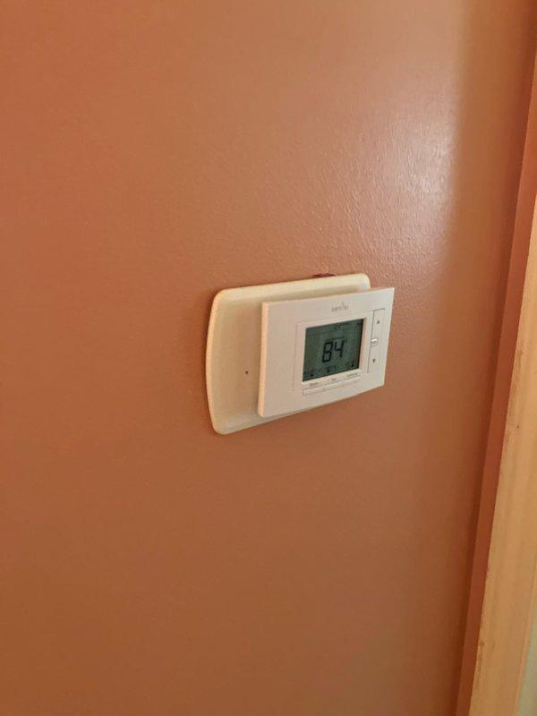 Responded to customer complaint of inadequate cooling from 10-year-old air conditioning system with equipment located in basement. Performed comprehensive system inspection and diagnostic evaluation of existing HVAC unit, including assessment of outdoor condensing unit, interior thermostat functionality showing 84-degree reading, and overall system performance. Provided full system replacement estimate options to address cooling deficiency and aging equipment concerns.