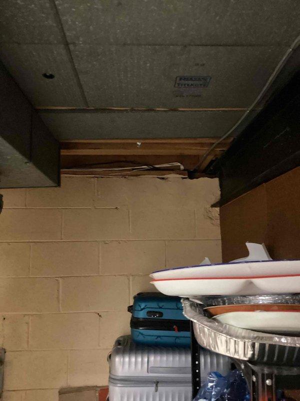 Evaluated 9-year-old air conditioning system in basement that would not start or turn on. Documented existing HVAC air handler unit with detailed measurements for replacement equipment sizing, including electrical requirements of 35A, unit dimensions, and ductwork specifications. Provided comprehensive replacement estimate with photographic documentation of current system configuration and installation environment.