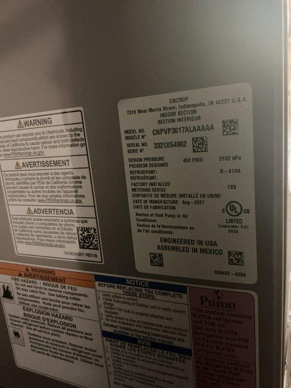 Responded to no cooling complaint on 4-year-old R-410A air conditioning system located in basement. Upon arrival, found Sensi thermostat displaying 83°F ambient temperature with no cooling mode available. Performed diagnostic evaluation of thermostat wiring and communication between thermostat and CNPVP1A7LAAAAA condenser unit. Inspected equipment specification label confirming R-410A refrigerant system manufactured in 2021 with 450 PSIG design pressure rating. Conducted full system inspection as requested, evaluating electrical connections, refrigerant circuit integrity, and control board functionality. Identified thermostat configuration issue preventing cooling mode activation. Restored proper thermostat settings and verified system communication. Cycled unit through complete operational test, confirming cooling mode now accessible and system responding appropriately to temperature calls. System returned to normal operation with all safety controls functioning properly.