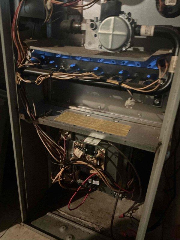 Responded to service call for non-functional thermostat in front room of residence. Removed and replaced 7-8 year old failed thermostat unit. Accessed HVAC furnace cabinet to verify proper wiring connections and system compatibility. Performed complete A/C system diagnostics using R410A refrigerant testing equipment, confirming proper system operation with total capacity of 35,332 Btu/h, sensible heat of 20,167 Btu/h, and latent heat of 15,165 Btu/h with sensible heat ratio of 0.57. Verified all electrical connections, control board functionality, and thermostat communication with furnace and air conditioning system. System tested and operating within normal parameters.
