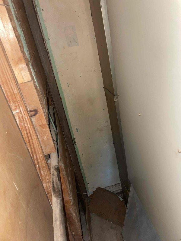 Provided replacement estimate for 25-year-old central air conditioning system located on west side of residence. Inspected existing outdoor condenser unit and indoor components, documenting current equipment condition through photos of aged HVAC ductwork and interior mechanical spaces showing weathered metal surfaces with oxidation. No immediate operational issues reported; estimate prepared for complete system replacement due to equipment age.