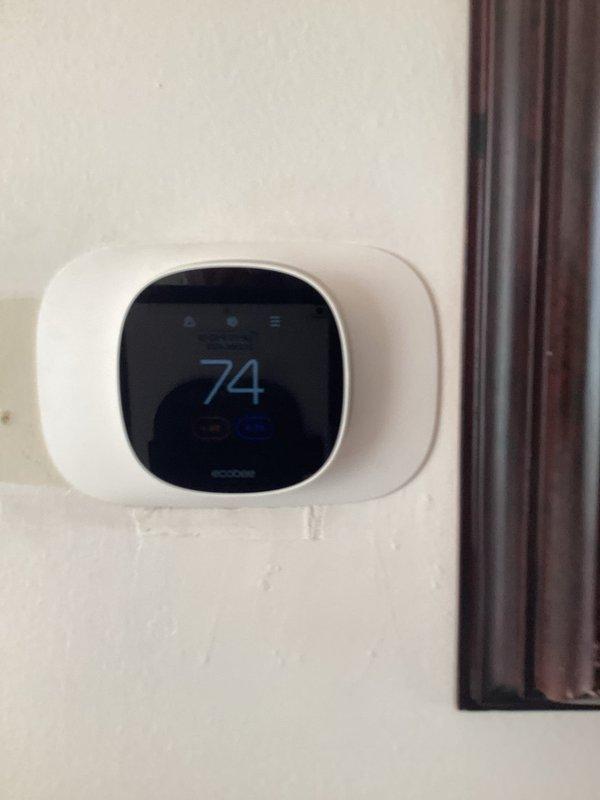 Completed comprehensive estimate for HVAC system replacement including two air conditioning units and two furnaces. Evaluated existing equipment configuration in mechanical room with overhead-mounted air handler, ductwork, and drainage systems. Assessed current thermostat setup including ecobee smart thermostat and provided recommendations for automatic heating/cooling changeover capability on both first floor and upper level units to meet operational requirements for seamless seasonal transitions.