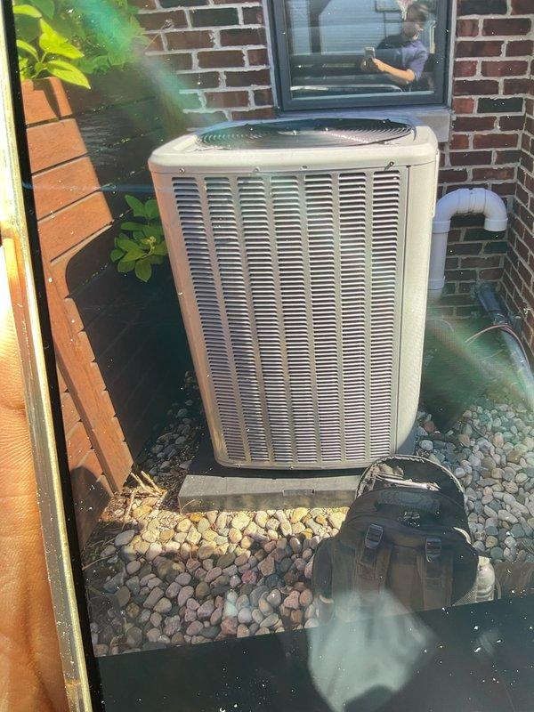 Completed comprehensive cooling system inspection on 3-year-old residential air conditioning unit. Performed standard maintenance protocol including visual inspection of outdoor condenser unit positioned on concrete pad with proper clearance, verified refrigerant line connections at air handler in basement showing normal patina on copper piping, confirmed all components operational and system cooling effectively. Unit found in good working condition with no immediate service needs identified.