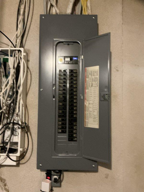Conducted site evaluation for air conditioning system replacement. Assessed existing outdoor AC unit of unknown age located in backyard area and inspected indoor air handler equipment in basement mechanical room. Documented electrical service panel configuration, ductwork connections, and current HVAC system layout to provide comprehensive replacement quote for new air conditioning equipment.