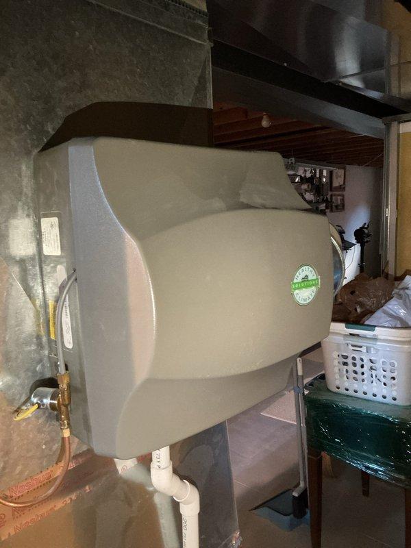 Responded to no cooling complaint on four-year-old air conditioning system located in basement. Upon arrival, verified thermostat was set to cooling mode at 75°F but system was not operating. Performed diagnostic evaluation of indoor and outdoor equipment, checking electrical connections, refrigerant pressures, and control circuits. Identified failed component covered under manufacturer warranty. Documented equipment conditions with photographs of basement mechanical room showing AC system location and thermostat settings for warranty claim processing.