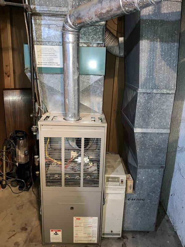 Conducted on-site assessment for complete HVAC system replacement at owner-occupied residence. Evaluated existing basement-mounted forced air furnace and outdoor condensing unit, both showing significant age-related deterioration including rust, discoloration, and accumulated wear. Documented current system configuration including ductwork layout, electrical connections, and equipment placement between structures. Prepared comprehensive replacement estimate for full heating and cooling system installation.