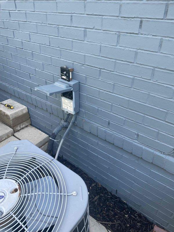 Conducted replacement estimate for a non-operational 10+ year old 4-ton air conditioning system with outdoor condenser unit and basement-located natural gas furnace. Assessed existing equipment configuration including electrical disconnect, conduit routing, and PVC venting system to determine proper replacement specifications maintaining equivalent 4-ton cooling capacity for the residence.