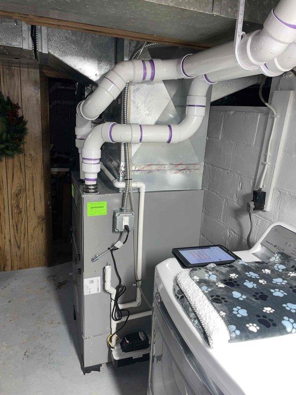 Conducted replacement estimate for a non-operational 10+ year old 4-ton air conditioning system with outdoor condenser unit and basement-located natural gas furnace. Assessed existing equipment configuration including electrical disconnect, conduit routing, and PVC venting system to determine proper replacement specifications maintaining equivalent 4-ton cooling capacity for the residence.
