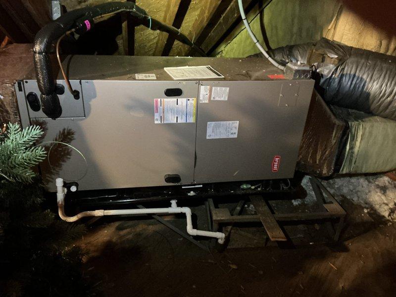 Responded to callback for no cooling issue on approximately 5-year-old system. Upon inspection of attic-mounted air handler, confirmed previous TXV replacement completed on 5/29. Verified unit operation, checked refrigerant lines, and inspected interior components including insulation and coil assembly. Documented system condition with photos showing air handler installation, ductwork connections, condensate drain lines, and internal components. System currently operational with adequate cooling restored following TXV replacement.