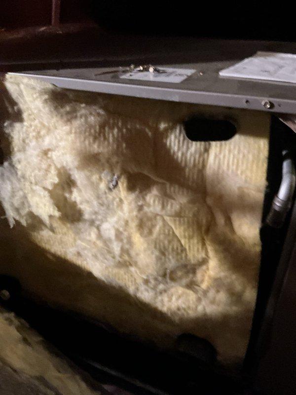 Responded to callback for no cooling issue on approximately 5-year-old system. Upon inspection of attic-mounted air handler, confirmed previous TXV replacement completed on 5/29. Verified unit operation, checked refrigerant lines, and inspected interior components including insulation and coil assembly. Documented system condition with photos showing air handler installation, ductwork connections, condensate drain lines, and internal components. System currently operational with adequate cooling restored following TXV replacement.
