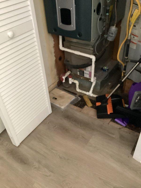 Provided estimate for complete HVAC system replacement in basement mechanical room. Current air conditioning unit is non-operational and over 10 years old. Existing system includes teal air handler with PVC condensate piping, natural gas furnace with yellow flex gas line, and Sensi programmable thermostat. Assessed equipment configuration, ductwork connections, electrical service, and condensate management system to develop comprehensive replacement proposal for new high-efficiency heating and cooling equipment.