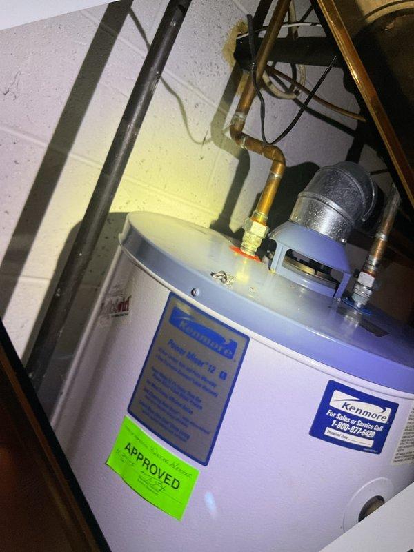 Completed scheduled prepaid maintenance visit and comprehensive AC system inspection per plan membership. Performed complete tune-up of air conditioning system including inspection of air handler equipped with iWave air purification system. Verified proper operation of all HVAC components, checked refrigerant levels, inspected electrical connections, and cleaned condensate drainage system. Also documented Kenmore water heater installation in utility area showing approved status and proper copper piping connections. All systems operating within normal parameters with no immediate service needs identified.