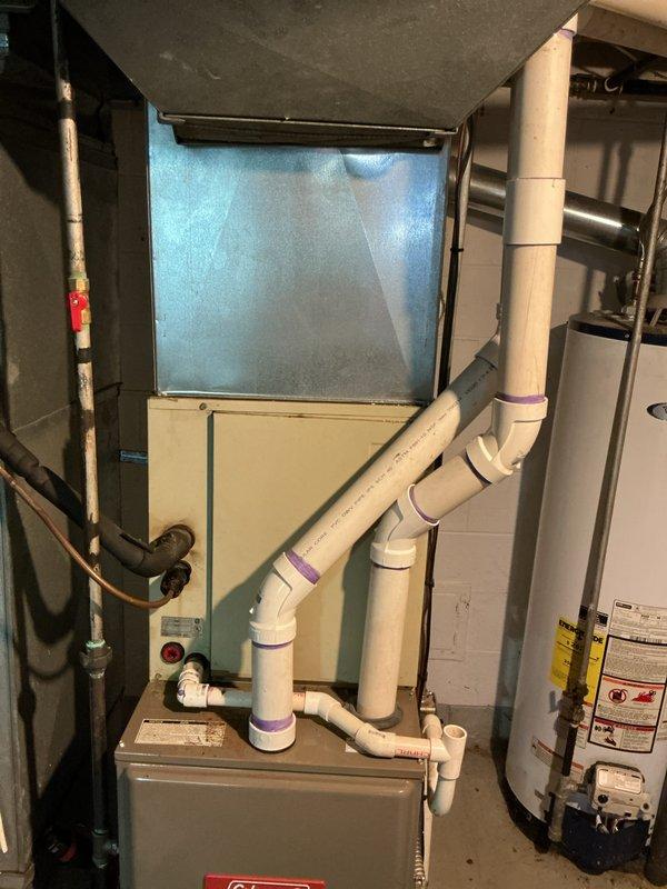 Provided estimate for replacement of failed air conditioning system and evaporator coil serving basement-located natural gas furnace installation. Existing 10+ year old equipment no longer operational, requiring complete AC system replacement including outdoor condensing unit and indoor coil component compatible with current air handler.