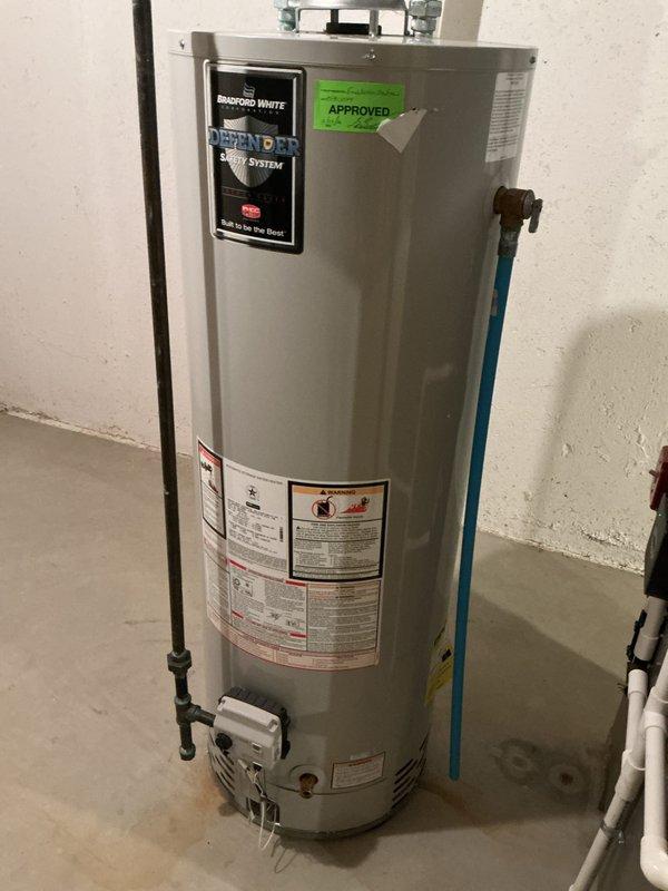 Completed comprehensive Gold Plan AC maintenance inspection on a one-year-old Lennox air conditioning system. Performed full tune-up service including inspection of outdoor condenser unit located on rubber pad between residential decks, verified proper installation on gravel base, checked refrigerant levels, cleaned condenser coils, tested electrical connections and capacitor function, and inspected indoor air handler unit in basement. All components found operating within manufacturer specifications with no deficiencies noted; system properly maintained and ready for cooling season.