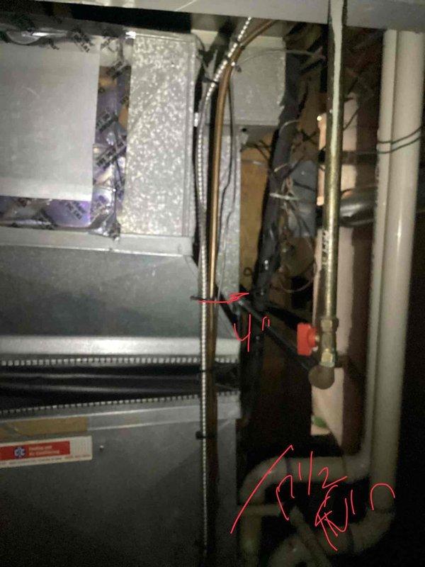 Responded to service call for air conditioning system not turning on at residential property. Performed diagnostic evaluation of basement-mounted HVAC system including gray metal air handler unit with coil assembly and associated ductwork. Provided estimate for complete system replacement due to equipment age and operational failure, documenting existing installation configuration with flexible metallic ductwork, vertical piping, and current air handler positioning for replacement specifications.