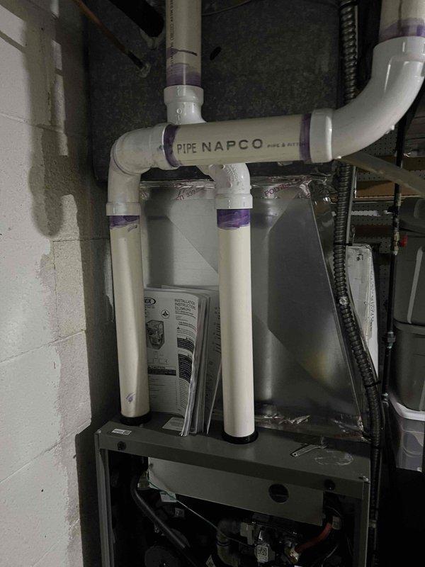 Completed comprehensive Gold Plan AC inspection on 10-year-old single cooling system with air handler located in basement. Performed full system evaluation including refrigerant pressure testing, which measured 0.27 amp draw indicating proper compressor operation. Inspected basement-mounted air handler, evaporator coil, and associated condensate drainage system. Verified proper operation of water filtration equipment and PVC condensate lines in mechanical room. Checked all electrical connections, ductwork integrity, and flexible duct connections to HVAC unit. System operating within normal parameters with no immediate service needs identified.