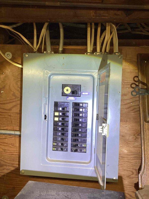 Conducted on-site assessment for complete HVAC system replacement in small residential property (0-1500 sq.ft.) with basement installation requirements. Evaluated existing natural gas heating and cooling infrastructure, documented current electrical panel configuration with multiple circuit breakers and main disconnect, and assessed utility room layout including water heater proximity and available clearances for new equipment installation. Provided comprehensive replacement quote for dual heating and cooling system suitable for basement mounting with natural gas energy source.