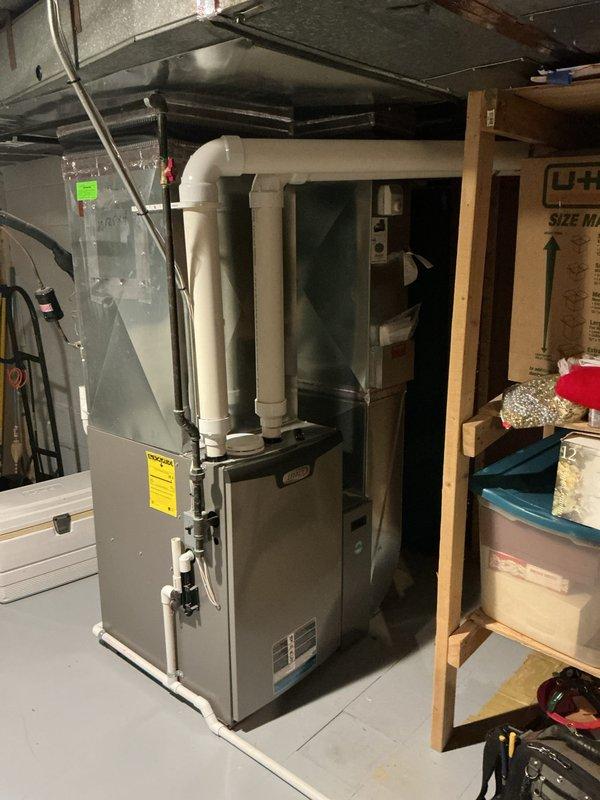 Completed Gold-level air conditioning inspection on 16+ year old system with evaporator coil located in basement. Performed comprehensive system evaluation, verified operational status of all components, and documented equipment condition with photographic records. Unit confirmed to be functioning properly at time of service.