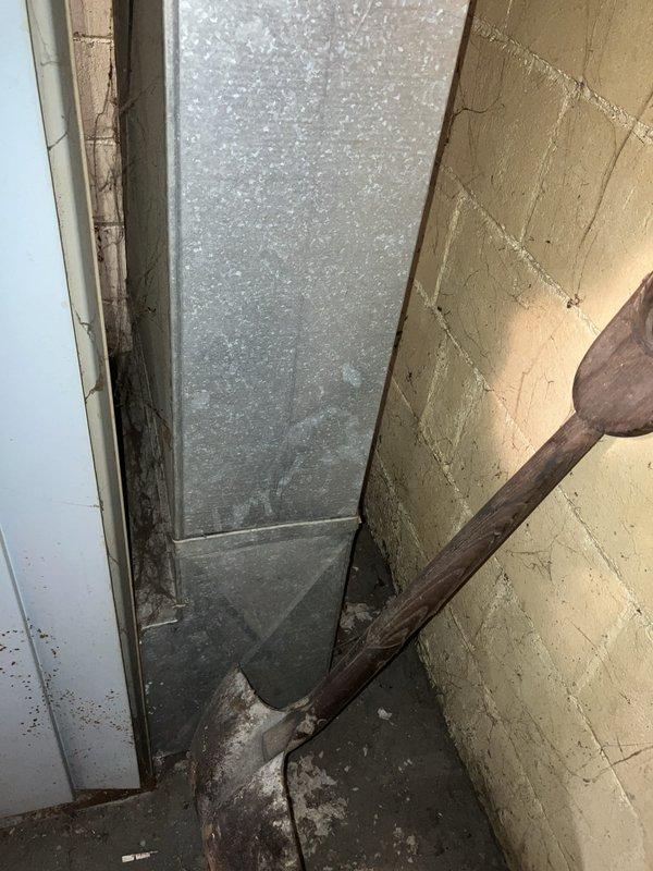 Responded to service call for air conditioning system not starting up in basement location. Evaluated 10+ year old cooling equipment and documented existing conditions of mechanical systems and utility area. Provided comprehensive replacement estimate for non-operational AC unit based on equipment assessment and site conditions.