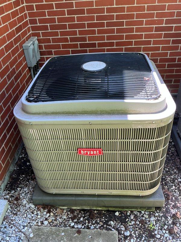 Completed Gold AC Inspection and routine maintenance on two Bryant air conditioning systems at residential property. Performed comprehensive tune-up including cleaning condenser coils, checking refrigerant levels, inspecting electrical connections, testing capacitors, and verifying proper airflow on both outdoor units positioned against exterior brick wall. Replaced furnace filters as requested and confirmed both systems operating within manufacturer specifications with no issues identified during inspection.
