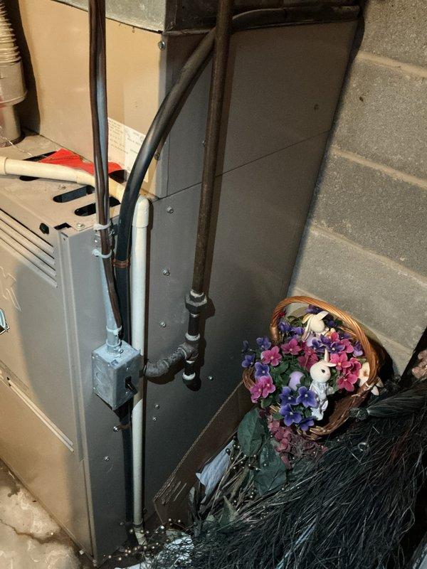 Responded to service call for non-operational cooling system with inoperative outdoor fan unit on 10+ year old equipment located on eastside of property. Conducted comprehensive assessment of existing HVAC system, including inspection of electrical panels, air handler, and associated refrigerant lines. Documented evidence of water accumulation at equipment base indicating potential condensation drainage issues. Provided estimate for complete system replacement due to age of equipment and extent of required repairs exceeding cost-effectiveness of continued service on existing units.
