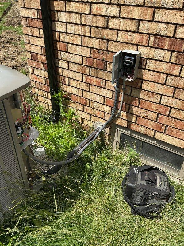 Responded to callback for 11-month-old AC system not cooling properly with equipment located in basement. Upon inspection, discovered condenser fan motor failure at outdoor unit. Removed and replaced defective fan motor assembly, verified proper electrical connections at disconnect box, and tested system operation. Unit restored to full cooling capacity with all components functioning within normal parameters.